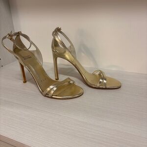 Gold Stuart Weitzman high heeled sandals